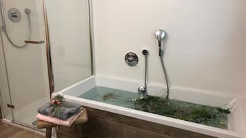 Bathtub, hair dryer, towels