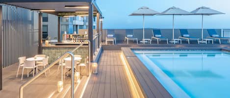 Outdoor pool, open 9:00 AM to 6:00 PM, pool umbrellas, sun loungers