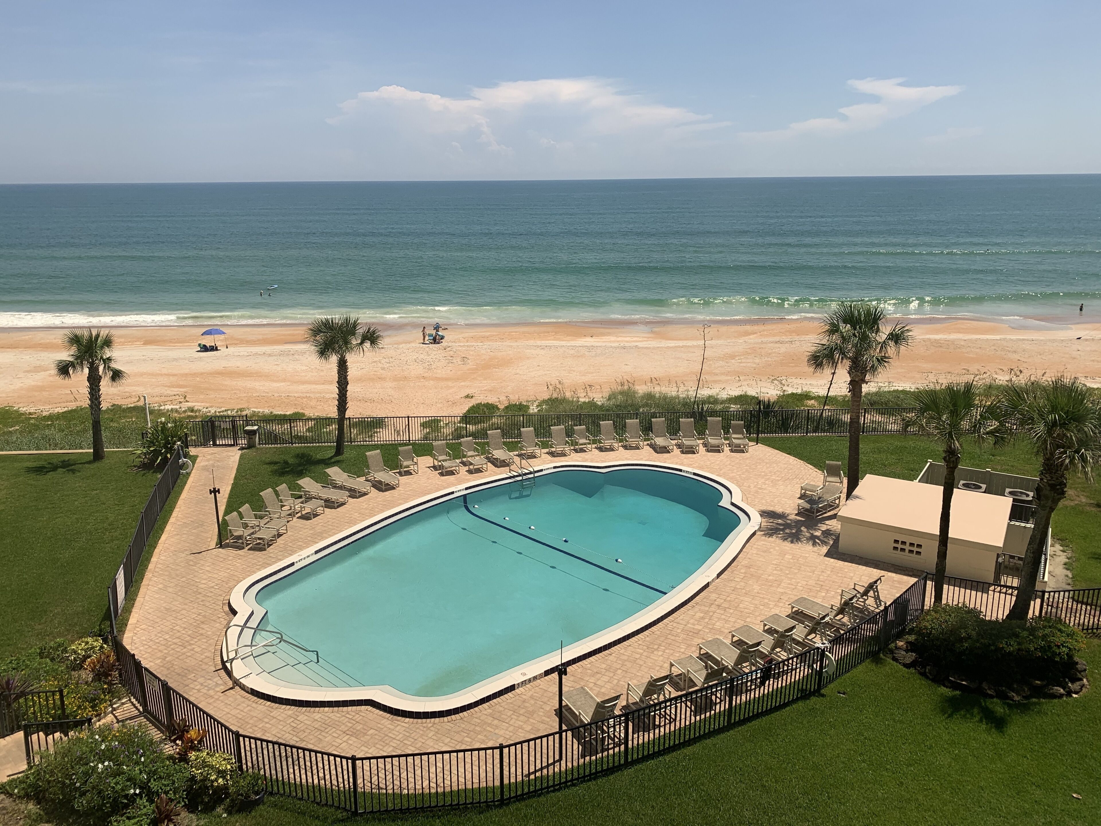 Beachfront, picture windows & sliders to a large balcony overlooking a huge pool