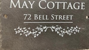 A sign for May Cottage at 72 Bell Street. - Charming 3-bed Cottage in Swanage (Swanage)