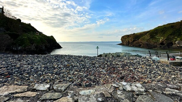 A rocky beach with a stone pathway leading to a pier. - Foxglove - Barn Conversion - Blossom  Farm (Haverfordwest)