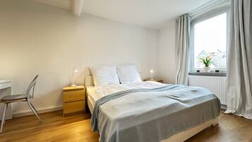 2 habitaciones, tabla de planchar con plancha y cuna de viaje