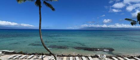On the beach, sun-loungers, beach towels