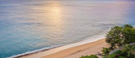 On the beach, sun loungers, beach towels
