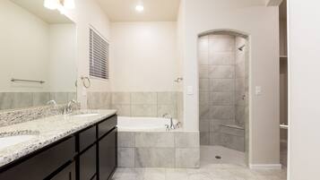 Combined shower/bathtub, jetted bath, hair dryer, toilet paper