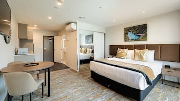 Premium bedding, blackout curtains, soundproofing, iron/ironing board