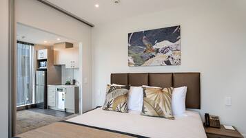 Premium bedding, blackout curtains, soundproofing, iron/ironing board