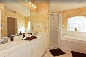 Combined shower/tub, hair dryer, towels, soap