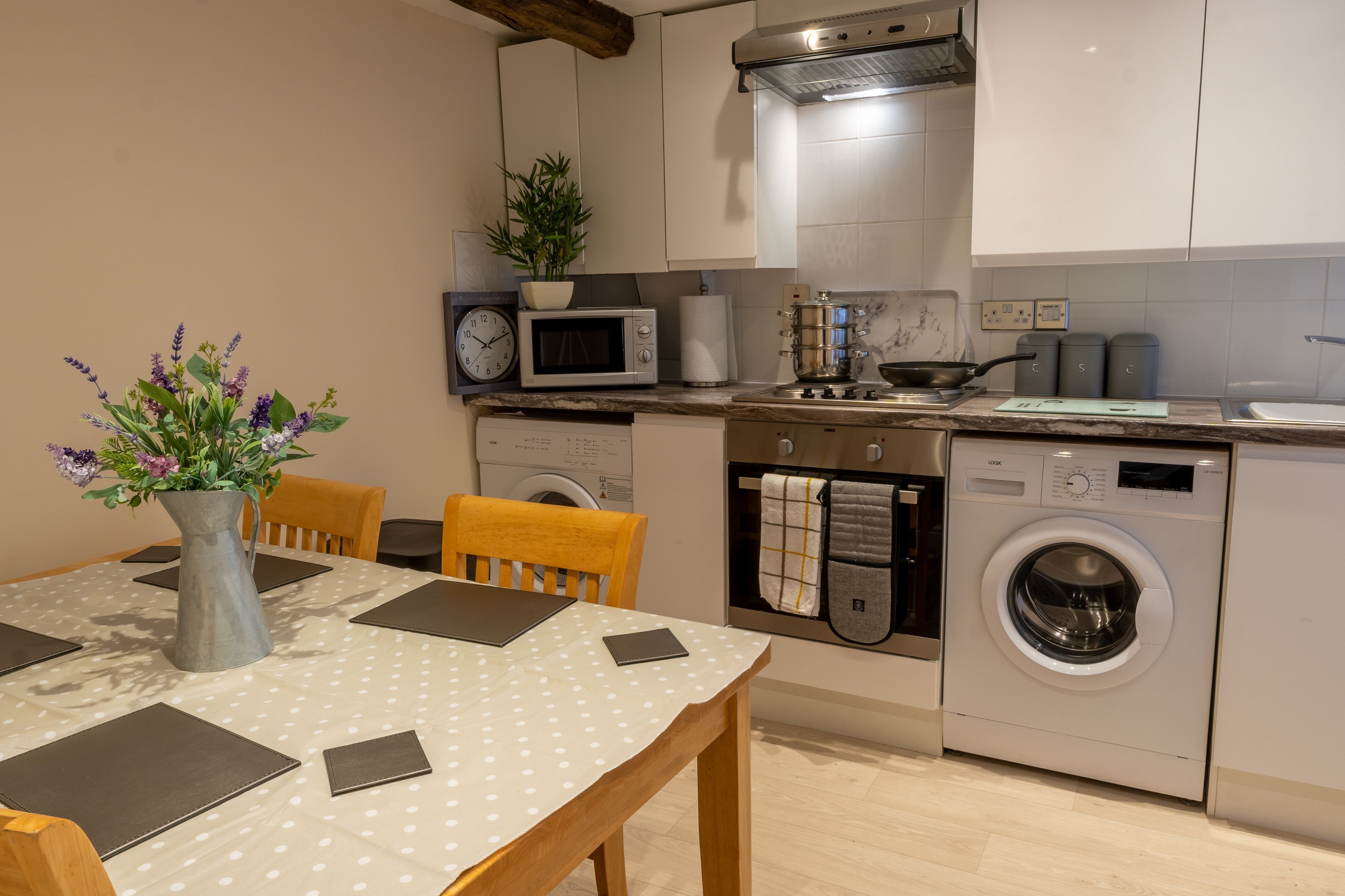 Microwave, oven, toaster, dining tables