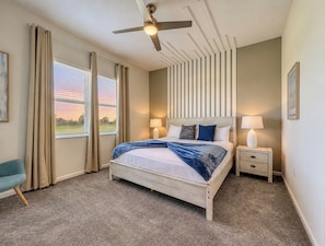 Cozy Bedroom with Wood Slat Accent Wall and Large Windows