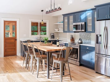 Clean, elegant and with all new appliances, the kitchen is a dream! Seats 12.