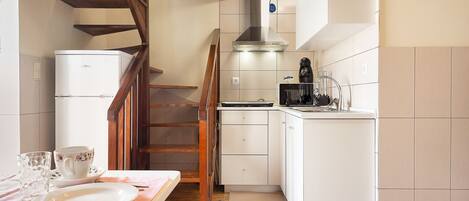 Fridge, microwave, stovetop, coffee/tea maker