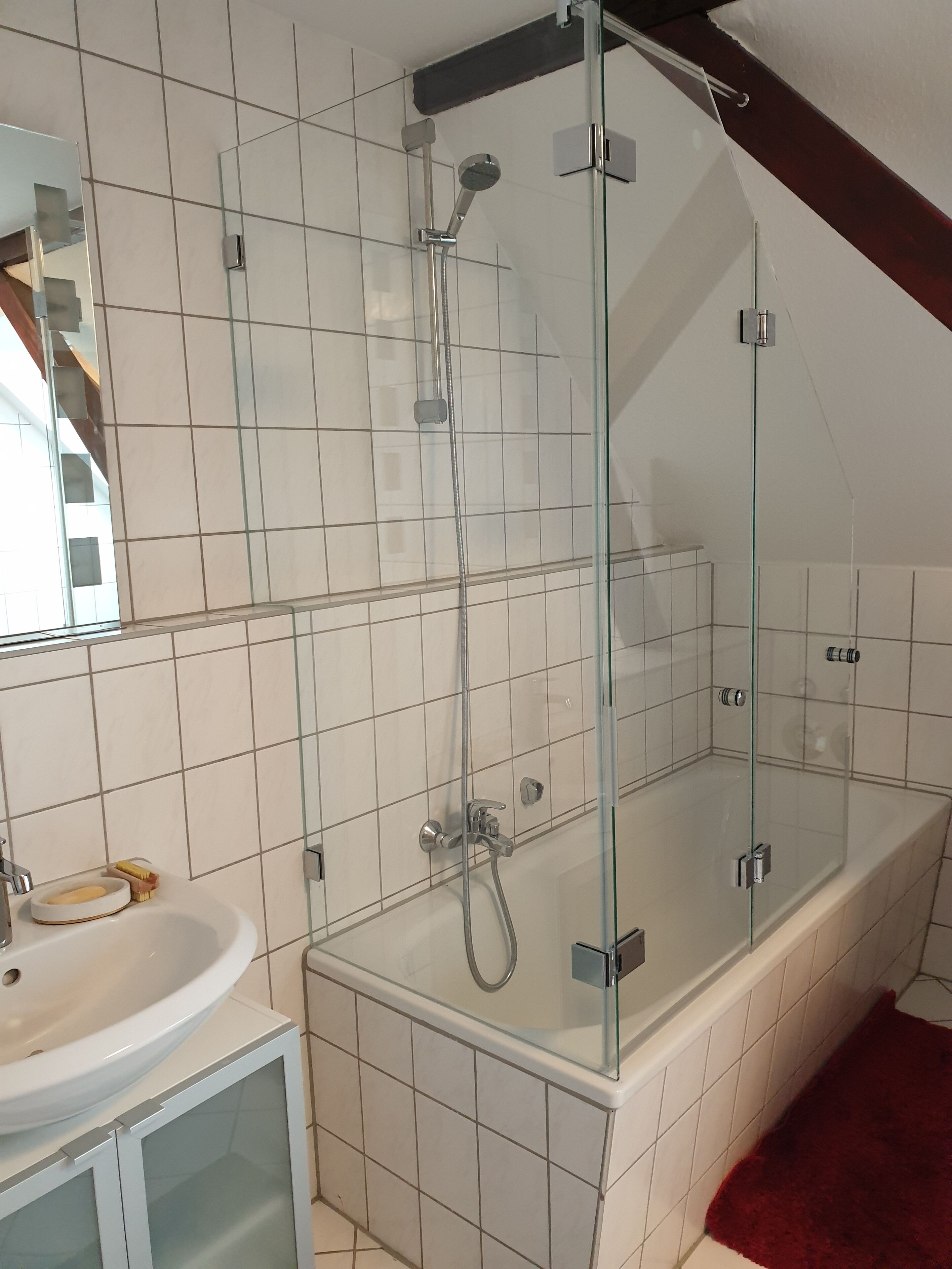 Combined shower/tub, hair dryer, towels, soap