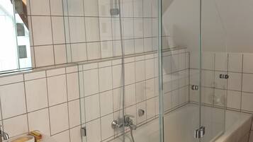Combined shower/tub, hair dryer, towels, soap