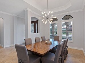 Enjoy meals in this spacious dining area with a large table and six comfortable chairs.