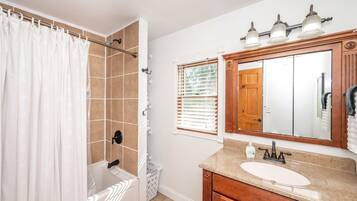 Combined shower/tub, hair dryer, towels, soap