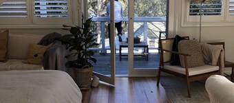 BIRDSONG <br>Stylish private couples loft with water glimpses through the treetops.