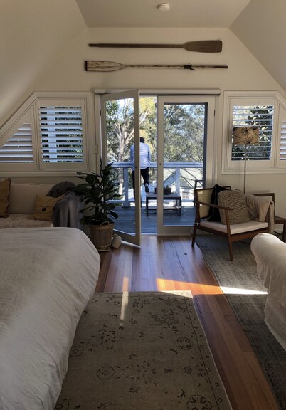 BIRDSONG <br>Stylish private couples loft with water glimpses through the treetops.