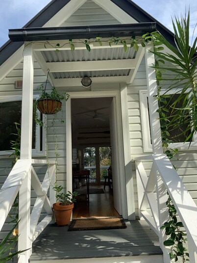 BIRDSONG <br>Stylish private couples loft with water glimpses through the treetops.