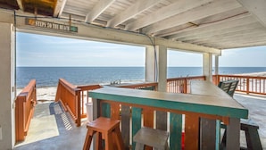 A covered outdoor area with a view of the ocean, featuring a table and benches, and a sign that reads "Steps to the Beach". - AWESOME VIEW... On Private Gulf of Mexico Beach... Majestic Views  🐢🌴🌞 (Alligator Point)