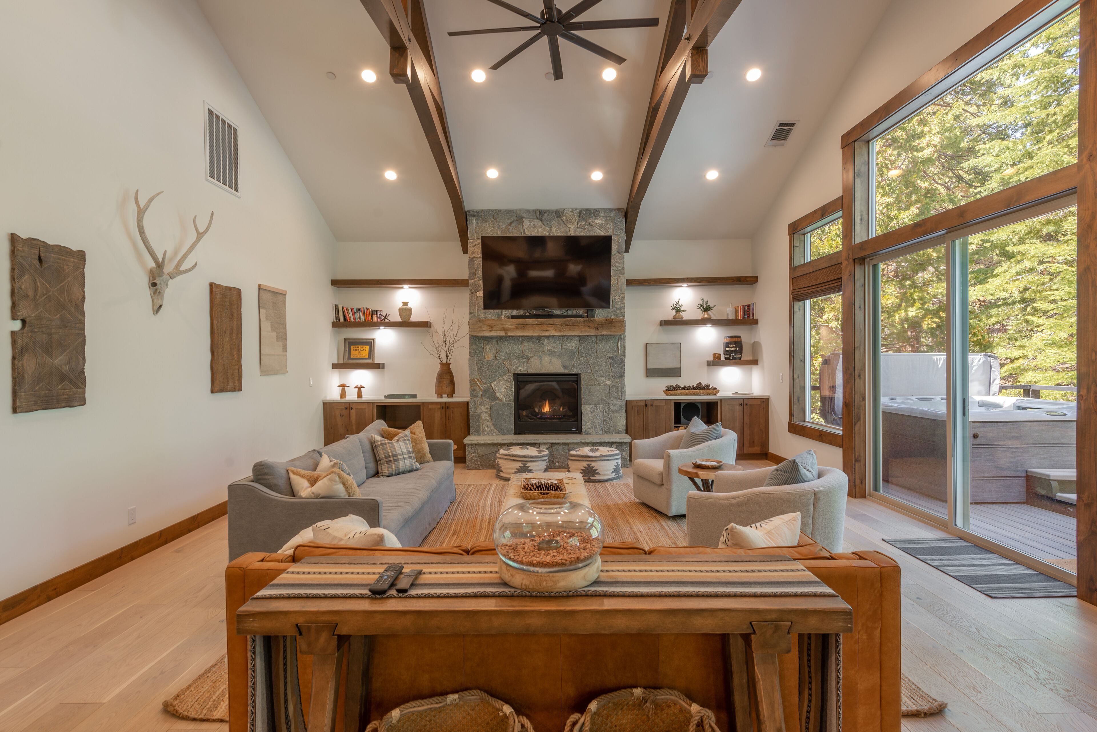 Another view of the large family room with vaulted ceilings & oversized fan