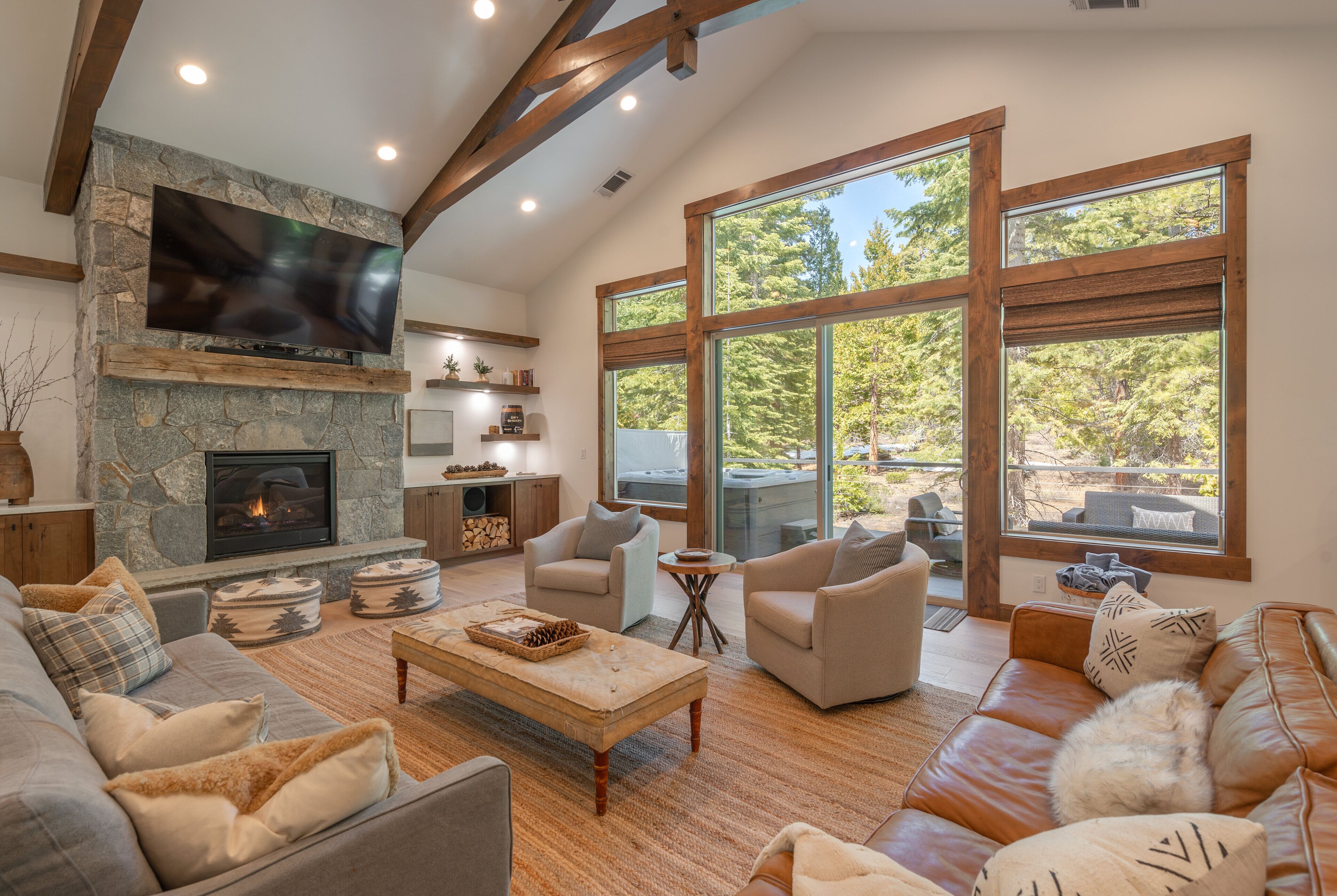Family room located on 2nd floor with large smart Tv & 2 sliders leading to deck