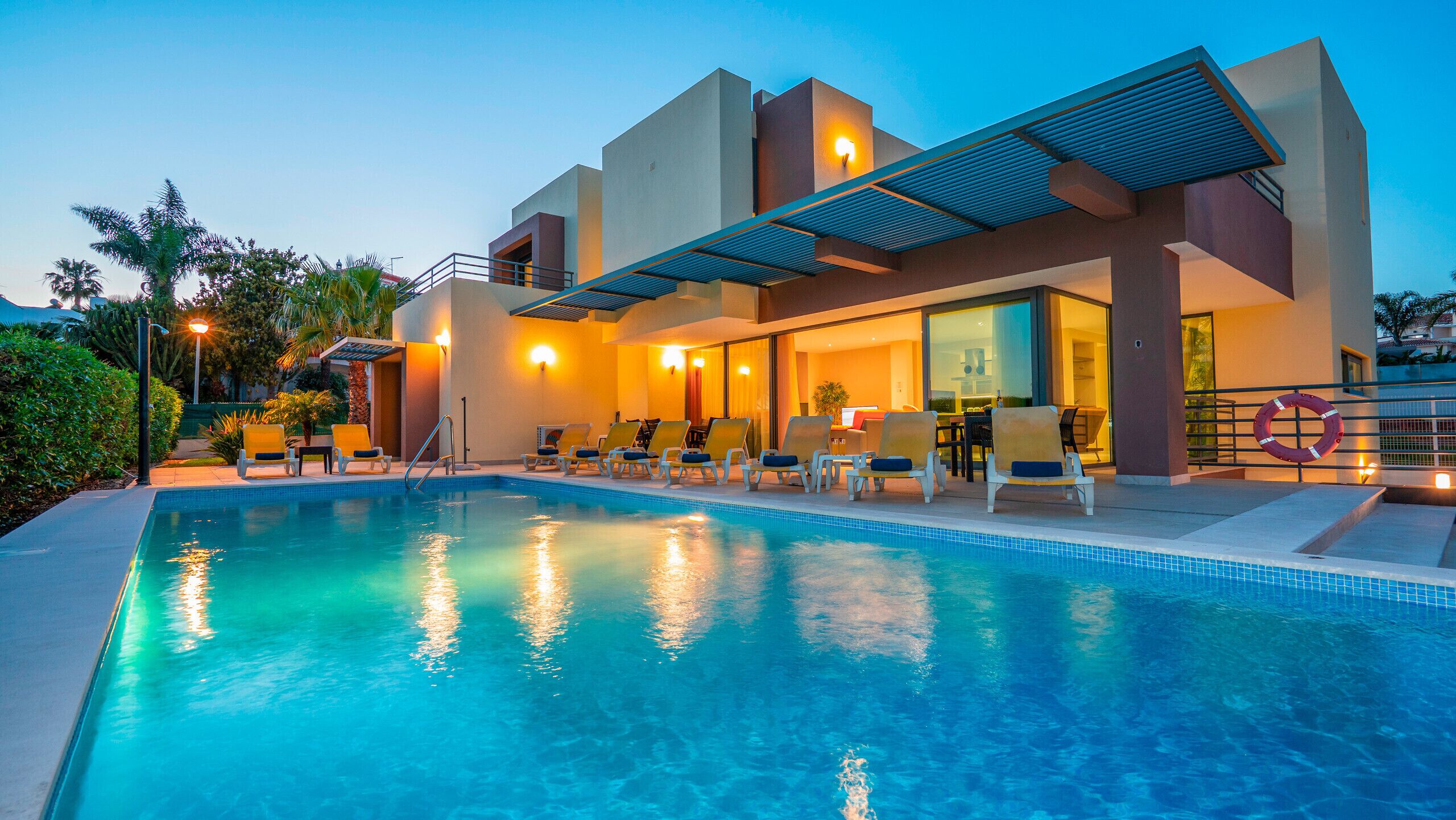 A heated pool, pool loungers