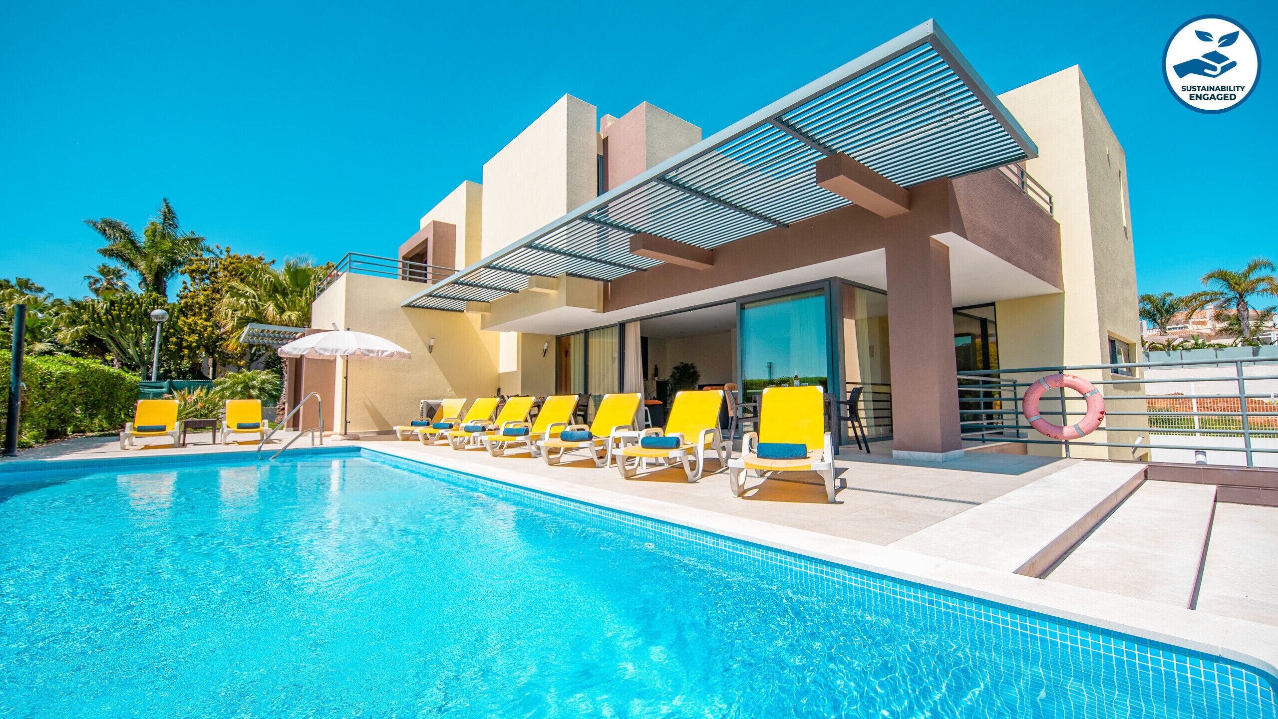 A heated pool, pool loungers