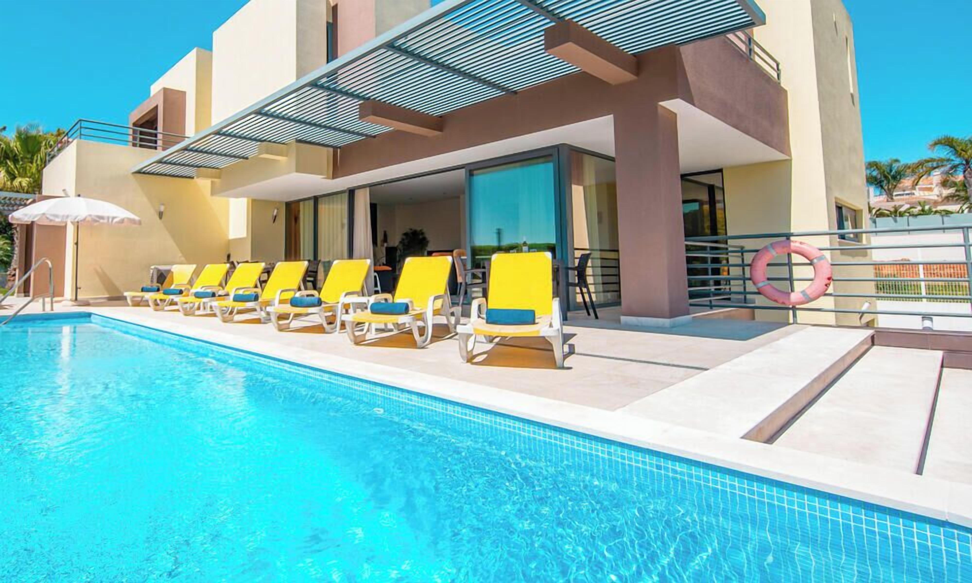 A heated pool, pool loungers