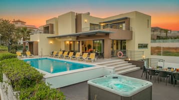 A heated pool, pool loungers