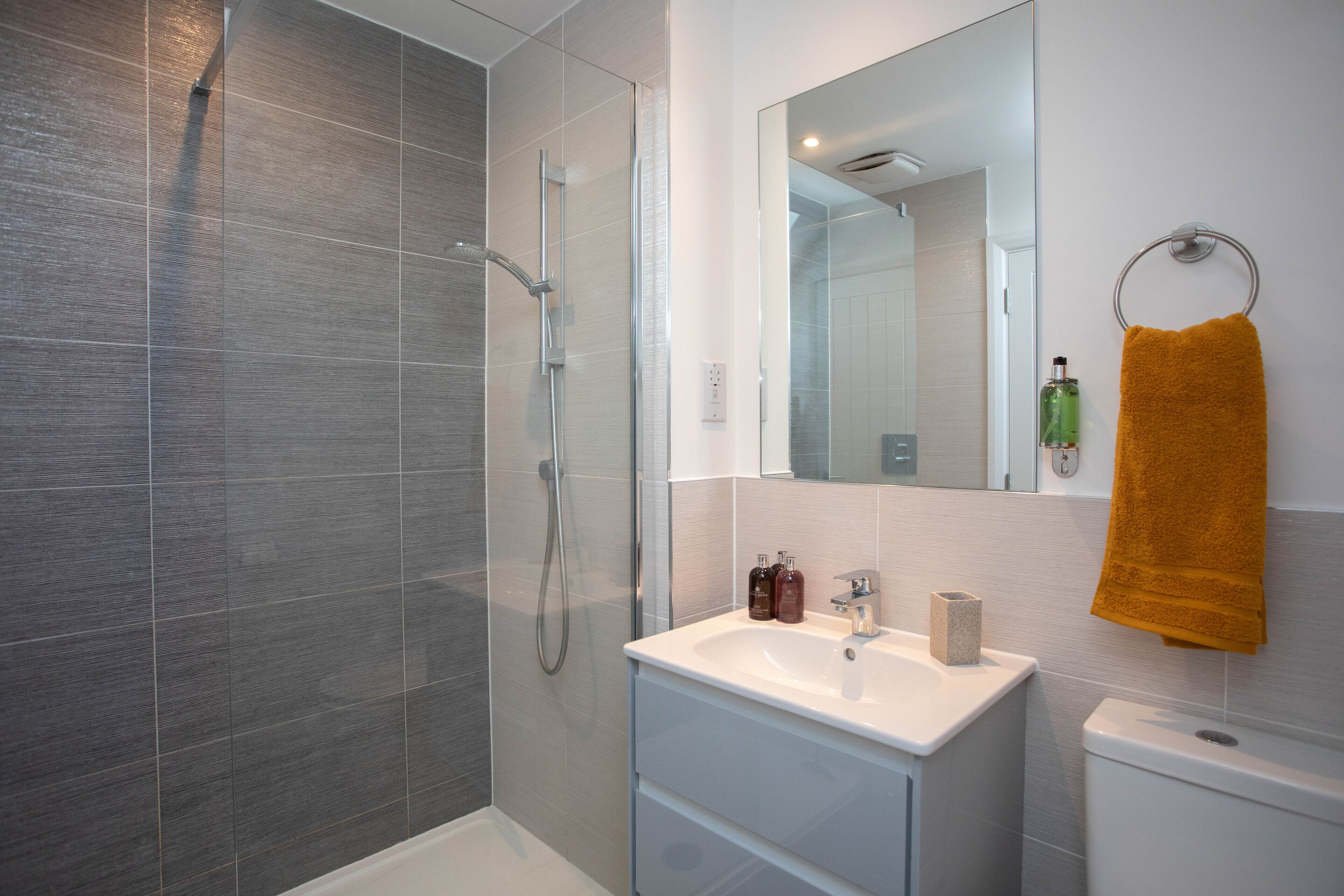 Combined shower/tub, hair dryer, towels, soap