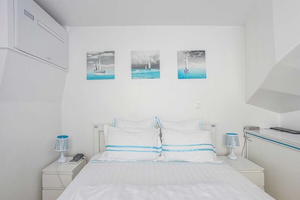 1 bedroom, desk, iron/ironing board, travel crib
