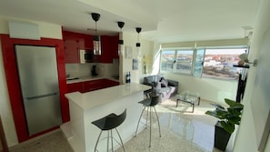 Fridge, microwave, stovetop, coffee/tea maker