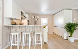 Fridge, stovetop, dishwasher, coffee/tea maker