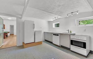 Fridge, stovetop, dishwasher, coffee/tea maker