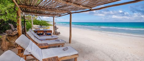 On the beach, sun-loungers, beach towels