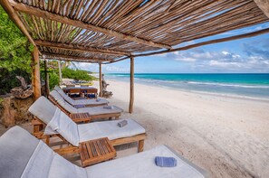 On the beach, sun-loungers, beach towels