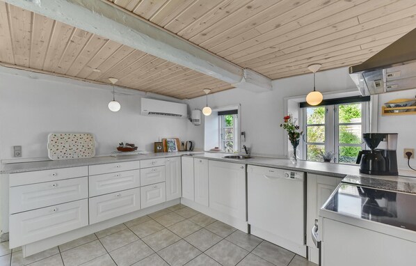 Fridge, stovetop, dishwasher, coffee/tea maker