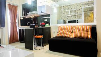 Quarto | Área de estar | TV