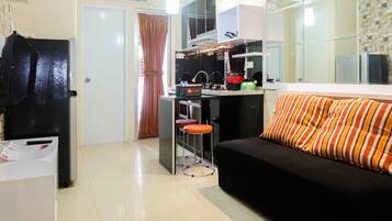 Quarto | Área de estar | TV