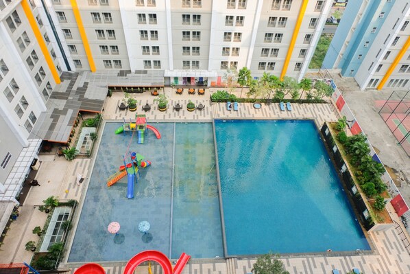 Outdoor pool - Homey and Simply Studio at Paramount Skyline Apartment (Gading Serpong)
