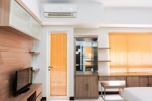 Room | Living area | Flat-screen TV - Cozy with City View Studio at Scientia Apartment (Gading Serpong)