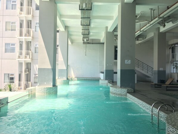 Outdoor pool - Cozy Studio Apartment Harvard Jatinangor (Cileunyi)