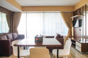 Room | Living room | TV - Modern 2BR Grand Kamala Lagoon Apartment (Bekasi)
