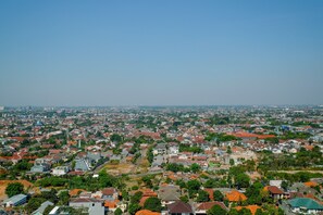 A residential area with houses and buildings, roads, and greenery. - Modern and Cozy 2BR Royal Olive Apartment (Jakarta)