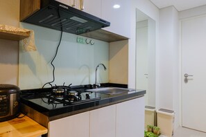 Private kitchenette - Elegant and Cozy 1BR Apartment at Bintaro Plaza Residence (South Tangerang)