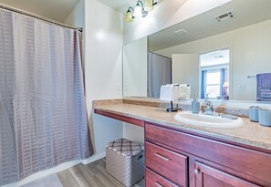 Combined shower/tub, hair dryer, towels, soap