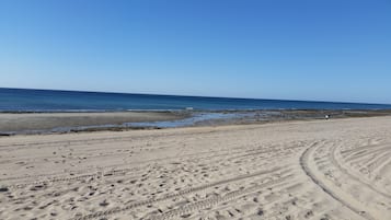 On the beach, sun loungers
