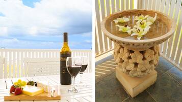 Enjoy a casual meal amidst a serene outdoor setting with a table set for two, a fountain, and a tranquil atmosphere.