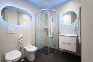 Bathroom | Shower, rainfall showerhead, hair dryer, bidet